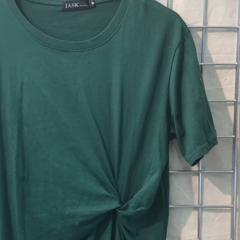 Tee shirt dress w side drape detail and easy fit.